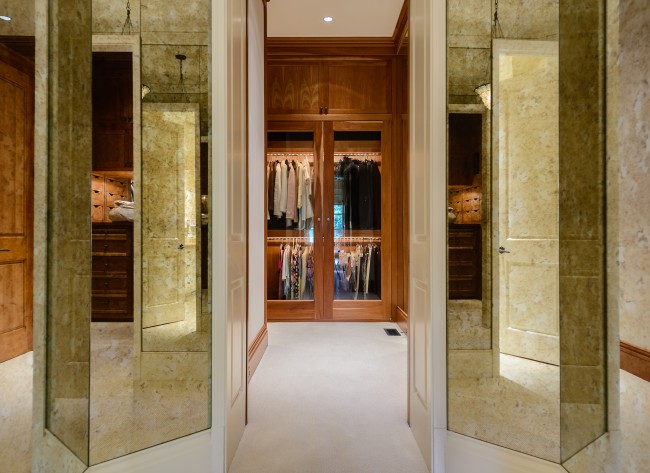 Cherry and glass cabinets in the dressing area and an exercise room help put this master suite over the top.